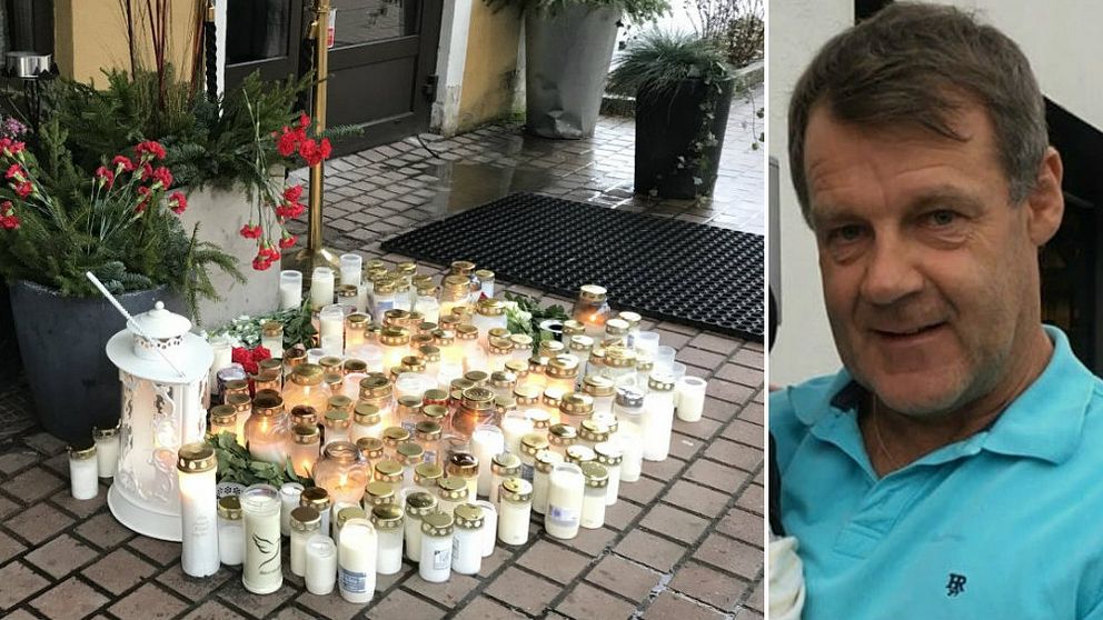 Mängder av gravljus och blommor utanför en entré samt man iklädd blå tröja