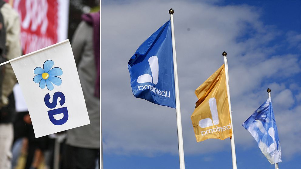 SD-flagga och Liberalerna-flaggor.
