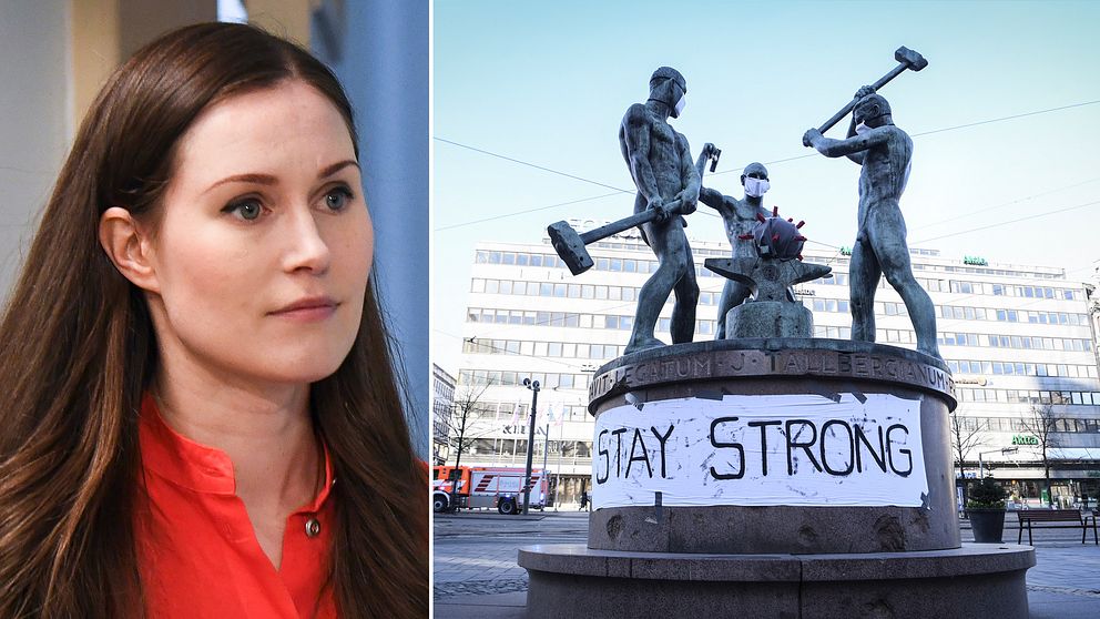Någon har försett statyn ”Tre smeder” i centrala Helsingfors med munskydd och en banner med orden ”stay strong” under coronapandemin.