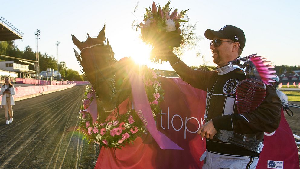 Trainer Daniel Redén of Sweden and horse Propulsion celebrate after winning the Elitloppet final trotting race on May 31, 2020 in Stockholm.