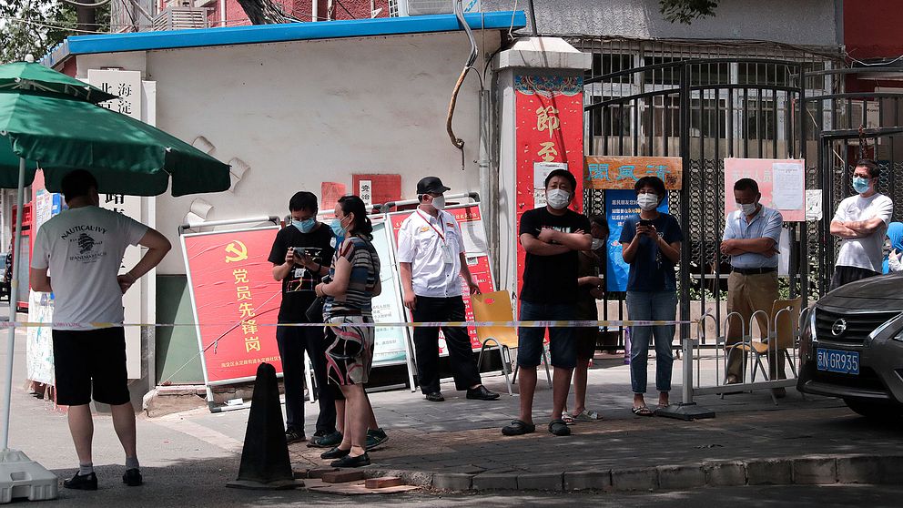 Folk med ansiktsmasker i Peking