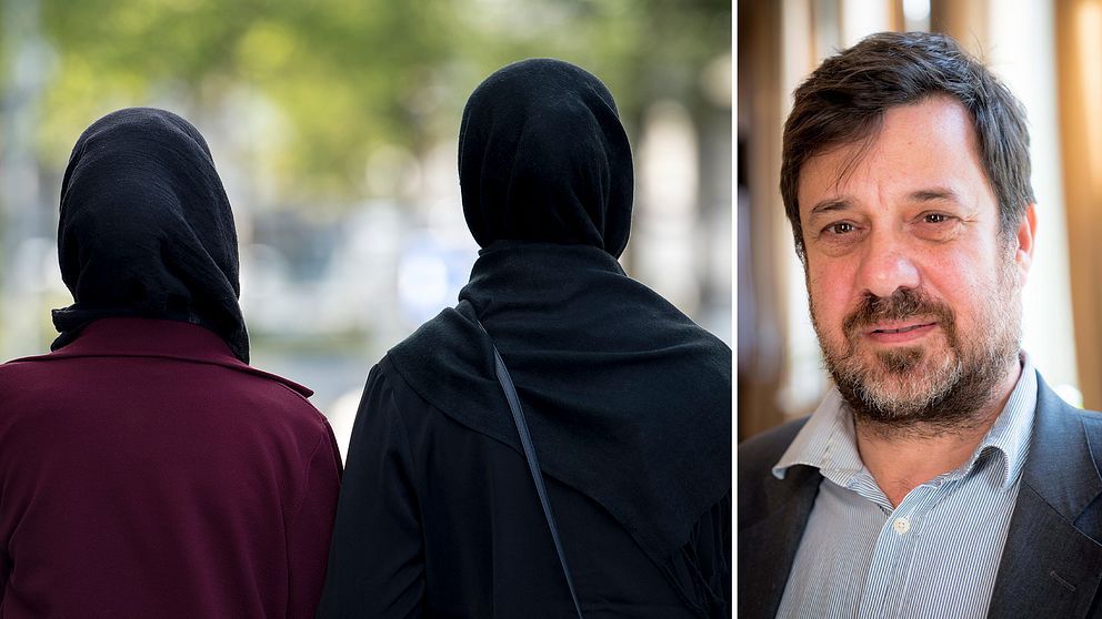 Två kvinnor iklädda hijab fotade bakifrån. Isak Reichel.