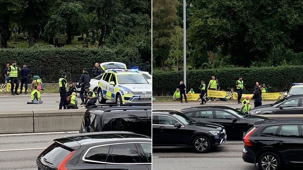 Polis ingriper mot personer i gröna västar som limmat fast sig på en väg.