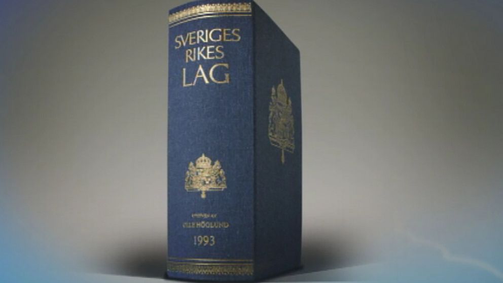 En bild på lagbok som står upp med gråblå bakgrund