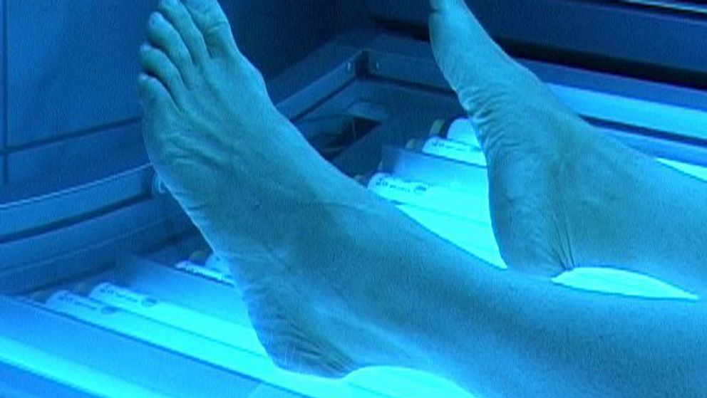 Fötter i ett solarium
