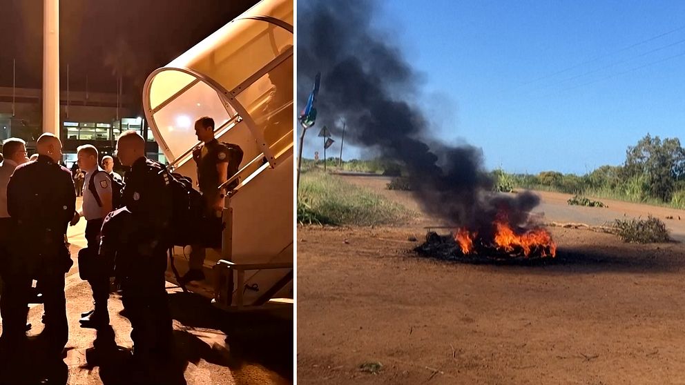 Franska militärer på väg ut från flygplan, eld brinner i Nya Kaledonien