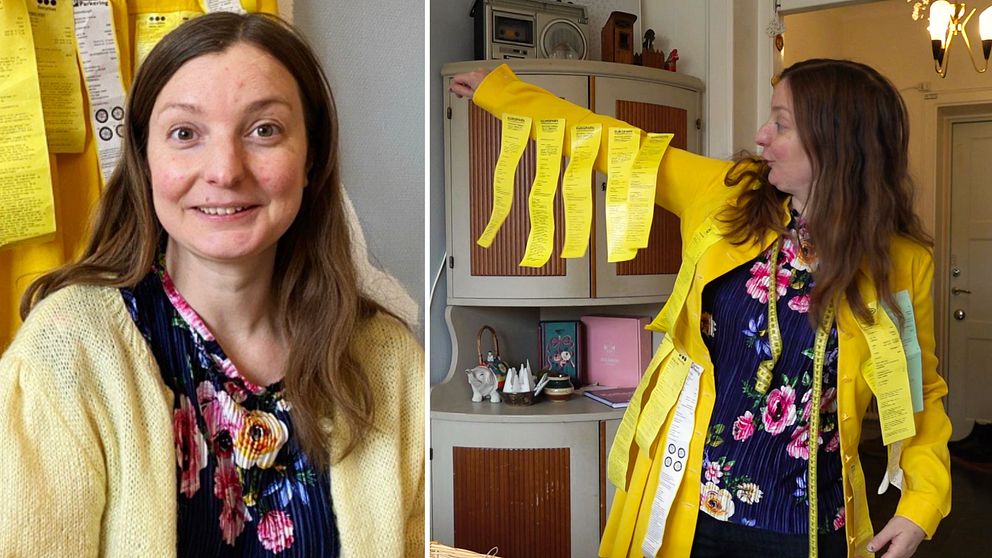 Emma Gustafsson sitter i sitt kök framför en gul klänning som hon har sytt fast parkeringsböter på.