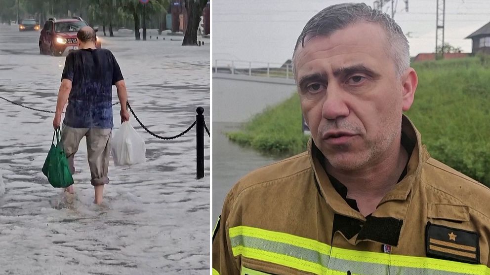 Brandman och person som går på en översvämmad gata.