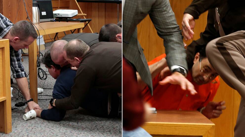 Larry Nassar, i orange dräkt, attackerades av ett av offrens pappa i rättssalen. Till vänster i bild hålls pappan ner av poliser.