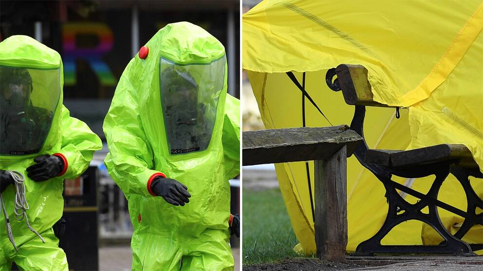 Två personer i skyddsutrustning samt bänken där de förgiftade hittades.