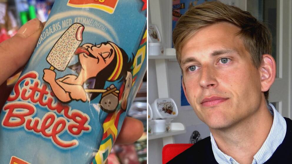 Glass med motiv och man i skjorta och blå tröja.