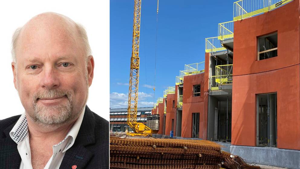Man med skägg och lyftkran framför hus som håller på att byggas