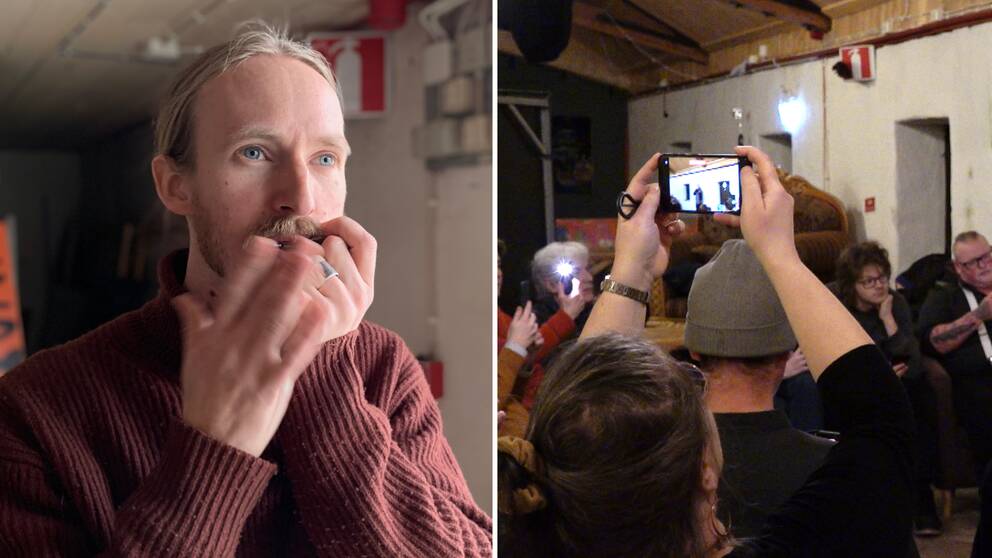 En man spelar munjiga (Klas Wikström af Edholm), flera människor är samlade i en lokal, en kvinna håller upp en mobiltelefon och filmar.