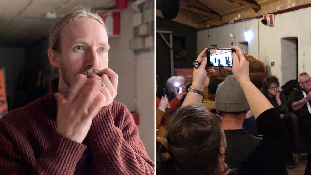 En man spelar munjiga (Klas Wikström af Edholm), flera människor är samlade i en lokal, en kvinna håller upp en mobiltelefon och filmar. 