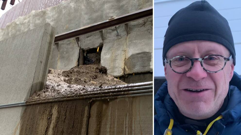 En man i glasögon och mössa framför en raserad stödmur i centrala Åre.