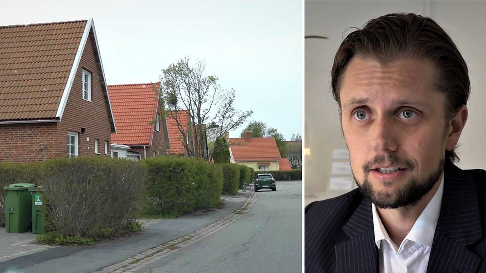 Villagata med tegelhus i Östersund. Gröna höga häckar framför.