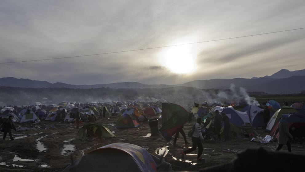 Migrants living in tents at a flooded field at the northern Greek border station of Idomeni, Tuesday, March 8, 2016. Up to 14,000 people are stranded on the outskirts of the village of Idomeni, with more than 36,000 in total across Greece, as EU leaders who held a summit with Turkey on Monday said they hoped they had reached the outlines of a possible deal with Ankara to return thousands of migrants to Turkey. (AP Photo/Visar Kryeziu)